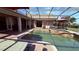 Enjoy this private screened-in pool with a relaxing spa, perfect for outdoor entertaining and leisure at 1534 Gants Cir, Kissimmee, FL 34744