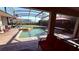 Inviting pool area with screened enclosure, spa, and patio furniture at 1534 Gants Cir, Kissimmee, FL 34744