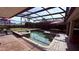 Lush pool and spa area with covered patio at 1534 Gants Cir, Kissimmee, FL 34744