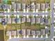 Aerial view of neighborhood with houses and solar panels at 1634 Reddish Egret Ct, Davenport, FL 33897