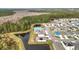 Aerial view of a new home community with a pool and pond at 1634 Reddish Egret Ct, Davenport, FL 33897
