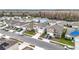 Community overview featuring houses with solar panels and a lake at 1634 Reddish Egret Ct, Davenport, FL 33897