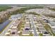 Aerial view showcasing a neighborhood with solar panels and serene ponds at 1634 Reddish Egret Ct, Davenport, FL 33897