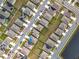 Aerial view of neighborhood with houses and solar panels at 1634 Reddish Egret Ct, Davenport, FL 33897