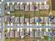 Aerial view of neighborhood with houses and solar panels at 1634 Reddish Egret Ct, Davenport, FL 33897