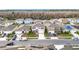 Community overview featuring houses with solar panels and a lake at 1634 Reddish Egret Ct, Davenport, FL 33897