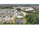 Aerial view of community including homes, pool, and nature at 1634 Reddish Egret Ct, Davenport, FL 33897