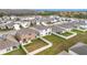 Aerial view of houses, showcasing fenced backyards and patios at 1634 Reddish Egret Ct, Davenport, FL 33897