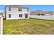 Grass backyard with a view of neighbor's house at 1634 Reddish Egret Ct, Davenport, FL 33897