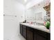 Double vanity bathroom with granite countertop at 1634 Reddish Egret Ct, Davenport, FL 33897