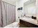 Clean bathroom with tub, shower, and granite vanity at 1634 Reddish Egret Ct, Davenport, FL 33897