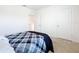 Cozy bedroom with plaid bedding and access to hallway at 1634 Reddish Egret Ct, Davenport, FL 33897