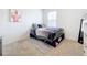 Cozy bedroom featuring a bed, dresser, and window at 1634 Reddish Egret Ct, Davenport, FL 33897