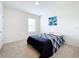 Well-lit bedroom with a double bed and window at 1634 Reddish Egret Ct, Davenport, FL 33897