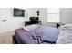 Serene bedroom featuring a TV and a desk at 1634 Reddish Egret Ct, Davenport, FL 33897