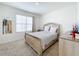 Bedroom with a large bed and window at 1634 Reddish Egret Ct, Davenport, FL 33897