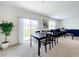 Bright dining area with sliding door access to backyard at 1634 Reddish Egret Ct, Davenport, FL 33897