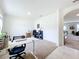 Bright home office features a workspace, built-in shelving, and carpet flooring at 1634 Reddish Egret Ct, Davenport, FL 33897