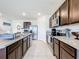 Open concept kitchen with granite counters and stainless steel appliances at 1634 Reddish Egret Ct, Davenport, FL 33897