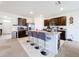 Modern kitchen with granite countertops and stainless steel appliances at 1634 Reddish Egret Ct, Davenport, FL 33897