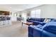 Open living space with comfortable seating and kitchen views at 1634 Reddish Egret Ct, Davenport, FL 33897