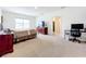 Main bedroom with large window and private bath access at 1634 Reddish Egret Ct, Davenport, FL 33897