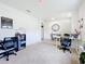 Well-lit office space with two desks, ample storage, and carpeted floor at 1634 Reddish Egret Ct, Davenport, FL 33897