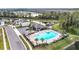 Community pool with a covered patio and surrounding landscaping at 1634 Reddish Egret Ct, Davenport, FL 33897