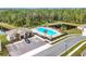 Community pool with adjacent parking and clubhouse at 1634 Reddish Egret Ct, Davenport, FL 33897