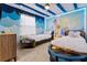 The bedroom has a mermaid theme, two twin beds, and LED lighting at 2190 Lelani Cir, Davenport, FL 33897