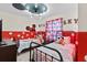 Mickey Mouse themed bedroom with twin beds and red polka dots at 2190 Lelani Cir, Davenport, FL 33897