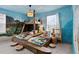 bedroom with a ship-themed bunk bed and ocean mural at 2190 Lelani Cir, Davenport, FL 33897