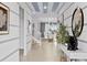 Bright entryway with high ceilings, striped walls, and view to the dining area at 2190 Lelani Cir, Davenport, FL 33897