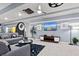 The game room boasts a large TV, comfortable seating, and stylish decor at 2190 Lelani Cir, Davenport, FL 33897