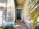 Inviting entryway with a dark door and brick accents at 2304 Cedar Garden Dr, Orlando, FL 32824