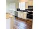 Modern kitchen with stainless steel appliances, granite countertops, white cabinetry, and stylish backsplash at 2304 Cedar Garden Dr, Orlando, FL 32824