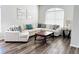Spacious living room featuring a large sectional sofa and wood flooring at 2304 Cedar Garden Dr, Orlando, FL 32824
