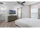 Spacious bedroom with wood-look floors, a large bed, and plenty of natural light at 2929 Caribbean Soul Dr, Kissimmee, FL 34747