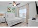 Serene bedroom with natural light, a queen-size bed, and a comfortable atmosphere at 2929 Caribbean Soul Dr, Kissimmee, FL 34747