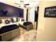 Charming bedroom featuring two twin beds, Mickey Mouse decor, and wood-look floors at 2929 Caribbean Soul Dr, Kissimmee, FL 34747