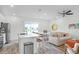 Inviting living room and kitchen area with modern appliances and a cozy seating arrangement at 2929 Caribbean Soul Dr, Kissimmee, FL 34747