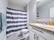 Clean bathroom with a shower/tub combo and white vanity at 3033 Sangria St, Kissimmee, FL 34744