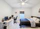 Bedroom with a bed, desk, and window coverings at 3033 Sangria St, Kissimmee, FL 34744