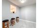 Bright breakfast nook with three stools and pass-through window to kitchen at 3033 Sangria St, Kissimmee, FL 34744
