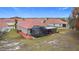 This home features a screened patio and artificial turf in the backyard at 3033 Sangria St, Kissimmee, FL 34744
