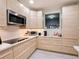 Modern kitchen with light wood cabinets, stainless steel appliances, and quartz countertops at 3033 Sangria St, Kissimmee, FL 34744