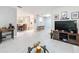 Living room with large TV, couches, and view to dining area at 3033 Sangria St, Kissimmee, FL 34744