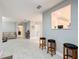 Living area with bar cart and view into kitchen area at 3033 Sangria St, Kissimmee, FL 34744