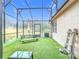 Enjoy this fenced-in patio with artificial turf, picnic table, and string lights at 3033 Sangria St, Kissimmee, FL 34744