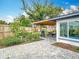 View of backyard with paver patio, covered pergola, dining area, and mature trees, ideal for outdoor relaxation at 420 Sunrise Dr, Orlando, FL 32803